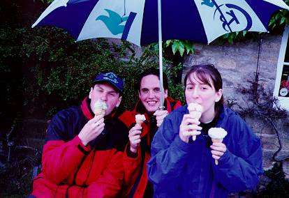 A picture of me enjoying an ice cream in the cold and wet.
